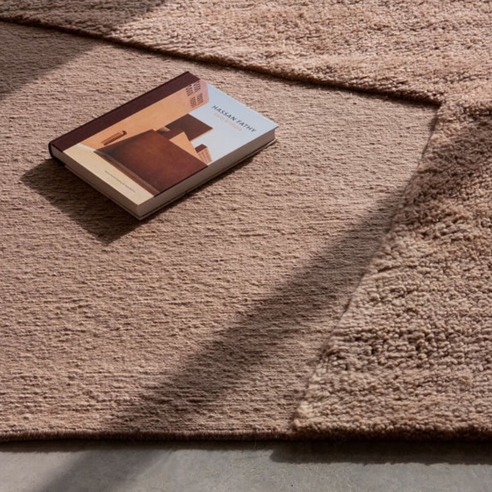 nanimarquina oblique rug pink quartz by matthew hilton with book and sunlight