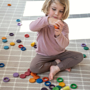 nanimarquina Tiles 1 rug with child playing