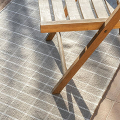 nanimarquina Tiles 1 runner outdoors with teak folding chair