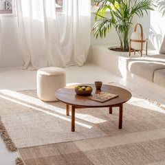 nanimarquina Tres Persian Pouf Natural in living room with Tres Vegetal Rug and Parlor Palm