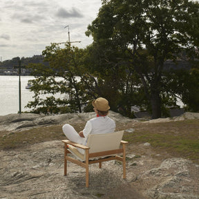 Pelagus Lounge Chair with Note Studio Designer on Rocky Shore in Stockholm