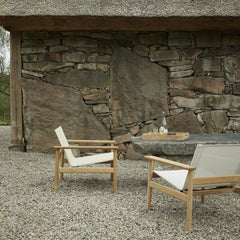 Pelagus Lounge Chairs Outside Stone House with Teak Drink Tray