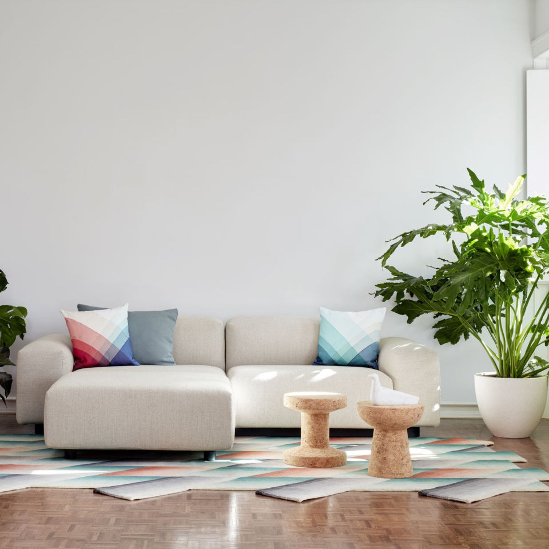 Vitra Cork Stools with Soft Modular Sofa and Plant in Light-Filled Living Room