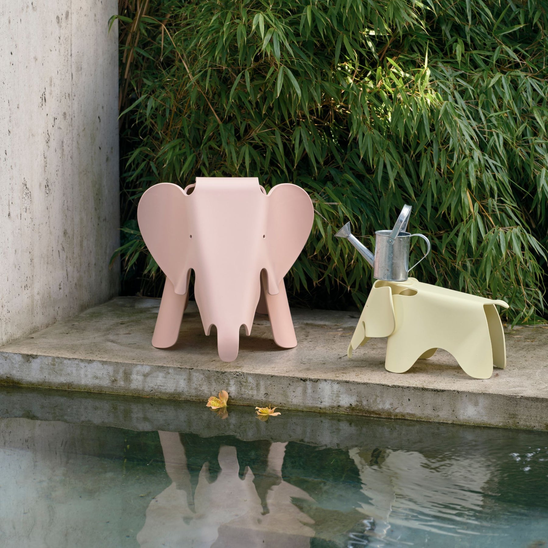 Vitra Eames Elephants Pale Rose RE and Canary RE by Pool