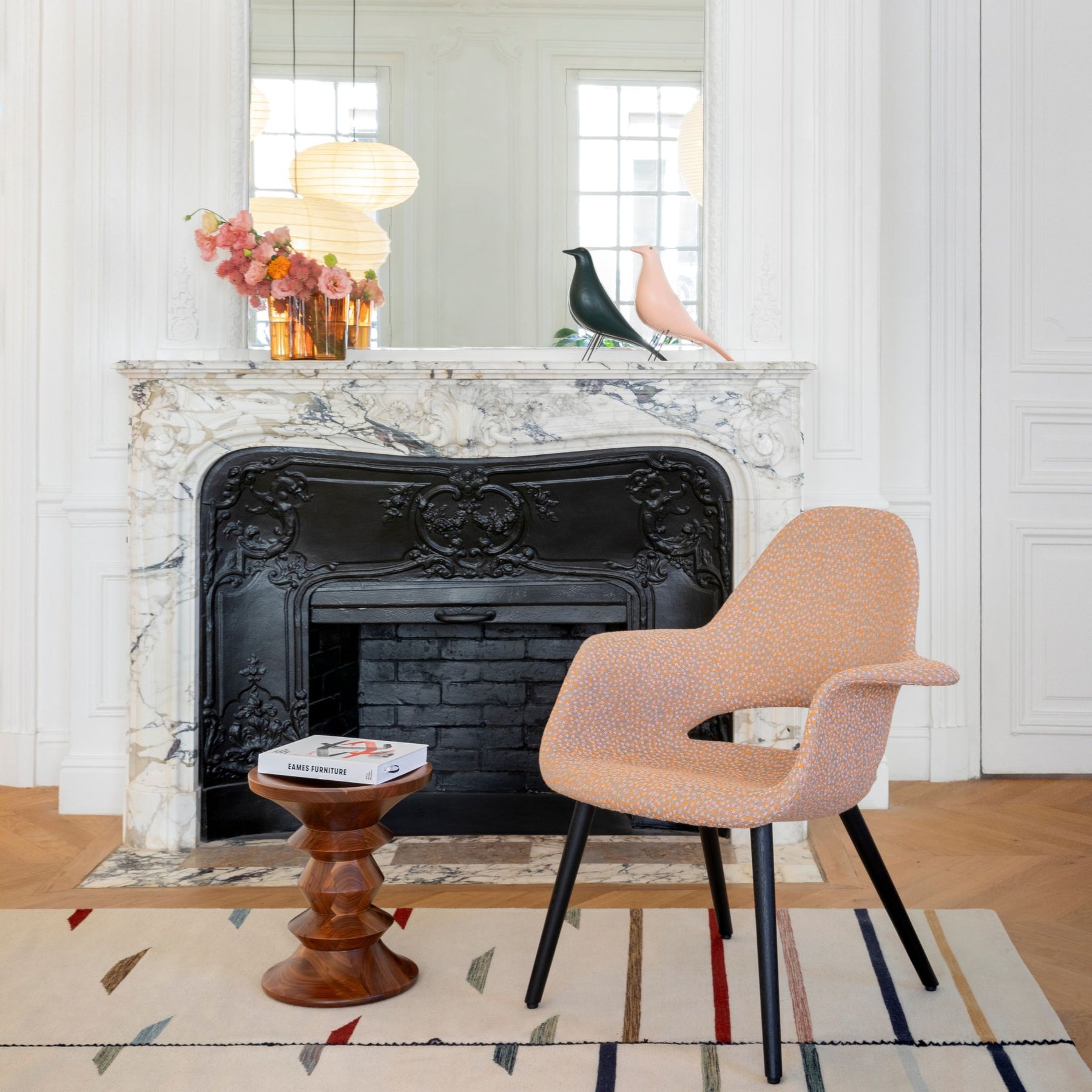 Vitra Eames House Birds on Mantel in Parisian Living Room with Eames Organic Chair