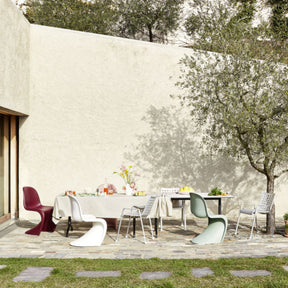 Vitra Landi Chairs and Panton Chairs Outdoors in Stone Courtyard