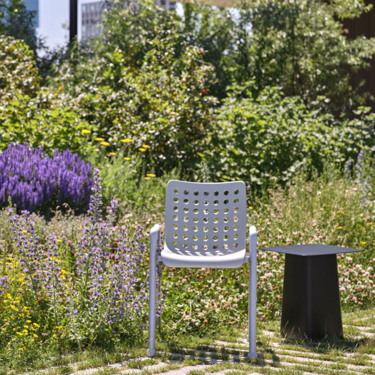 Vitra Landi Outdoor Chair by Hans Coray in City Garden with Bouroullec Metal Side Table