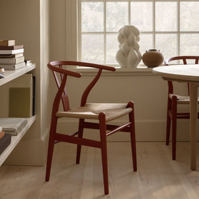 Carl Hansen Wegner Wishbone Chairs Ilse Crawford Soft Terracotta in Home Office with Book Shelves and Sculpture