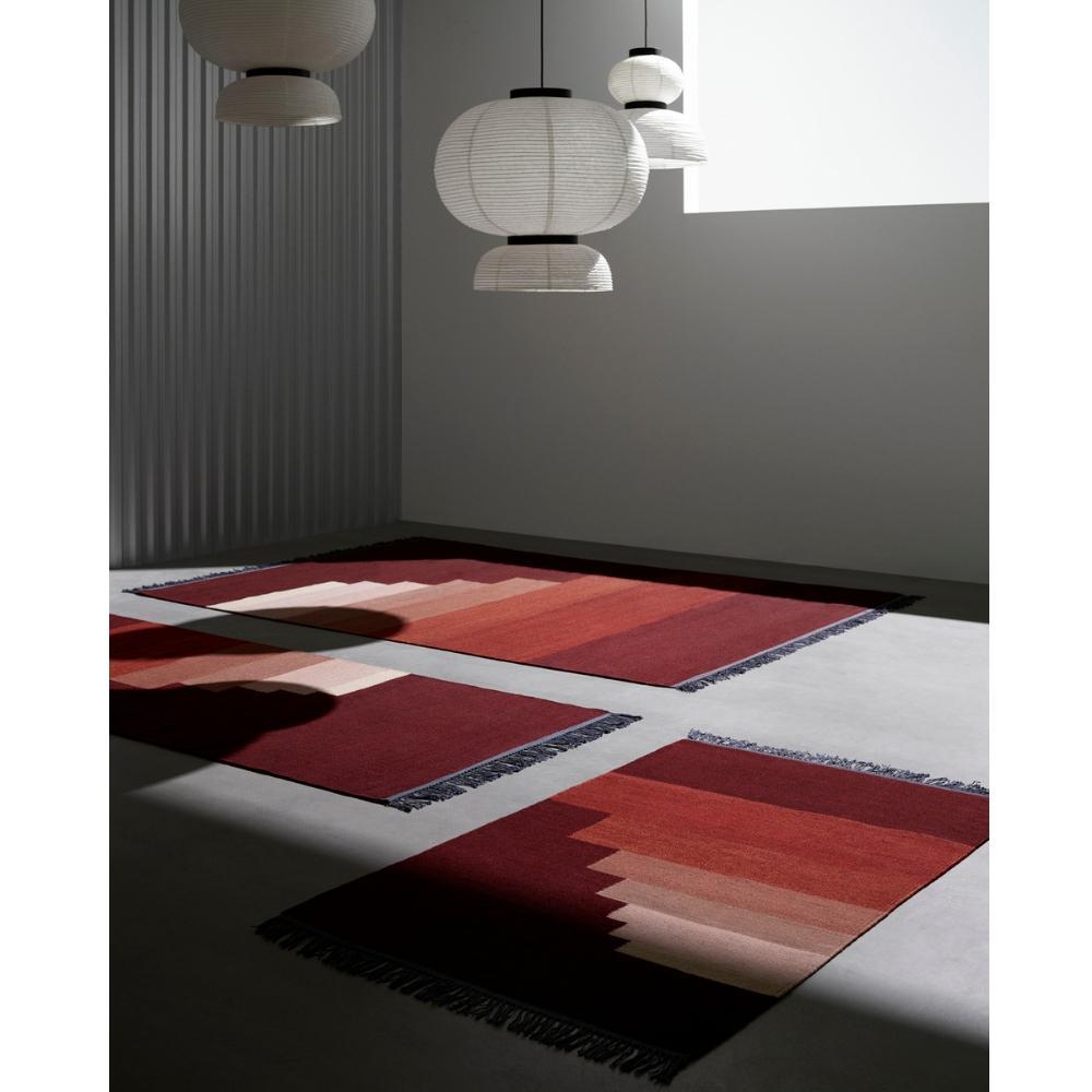 And Tradition Formakami Pendant lights by Jaime Hayon in room with rugs by All the Way to Paris