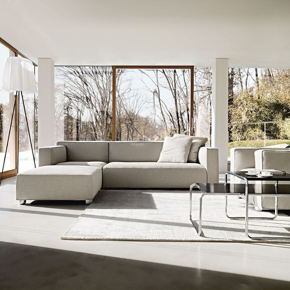 Barber Osgerby Asymmetric Sofa and Ottoman in Room with Breuer Laccio Coffee Tables