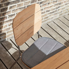 Lilium Teak Dining Chair with Charcoal Cushion by Bjarke Ingels Group for Skagerak