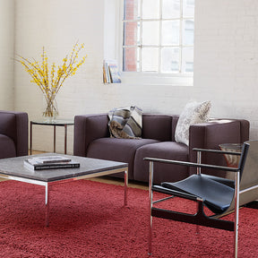 Pollock Sling Chairs in Room with Florence Knoll Coffee Table and Barber Osgerby Sofas