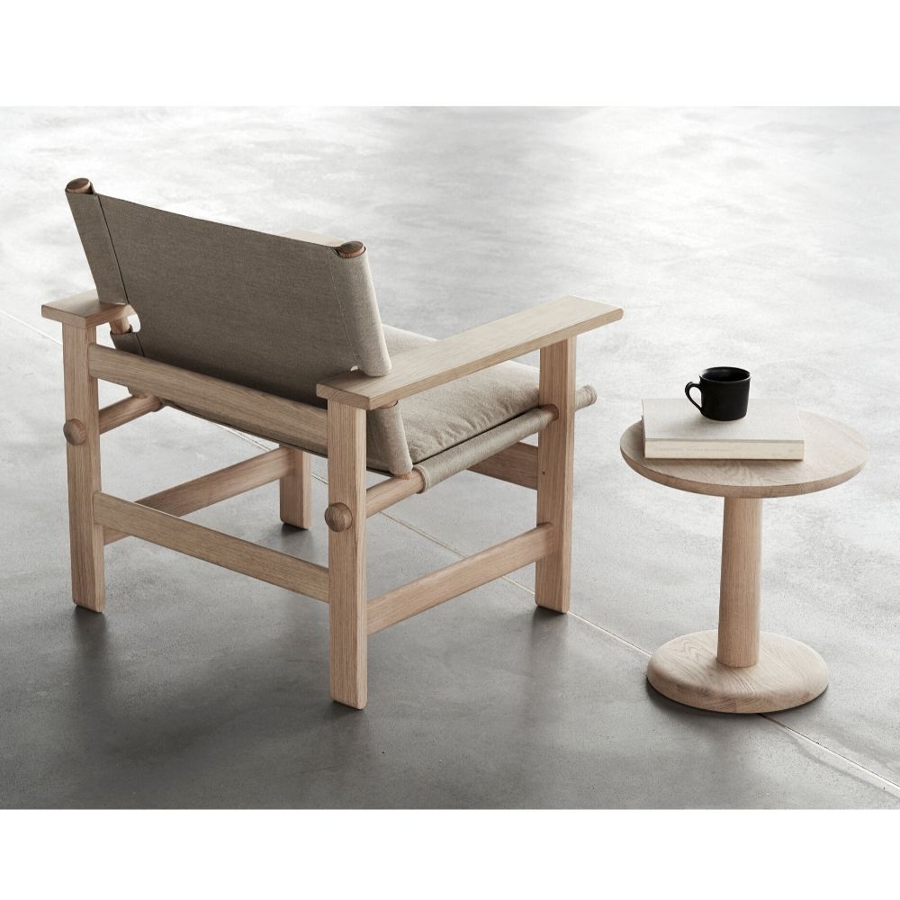 The Canvas Chair with Seat Cushion by Børge Mogensen with the Pon Sidetable by Jasper Morrison, both  for Fredericia
