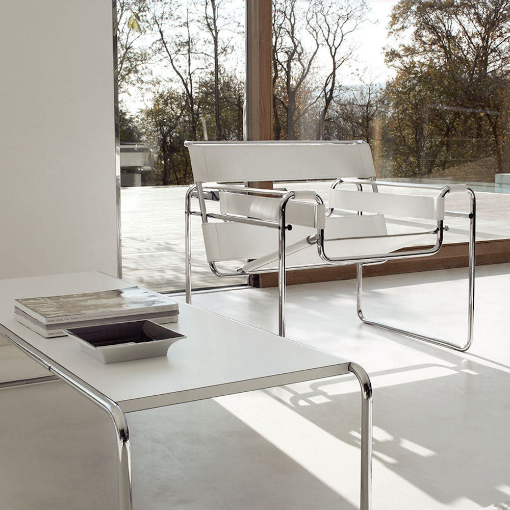 Marcel Breuer white laccio coffee table in room with white Wassily chair Knoll