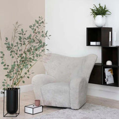 byLassen Tired Man Lounge Chair Moonlight in room with Kubus Vase and Shelves