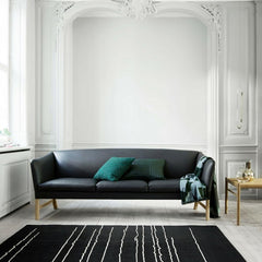 Carl Hansen and Son Ole Wanscher Sofa OW603 in room with Woodlines Rug