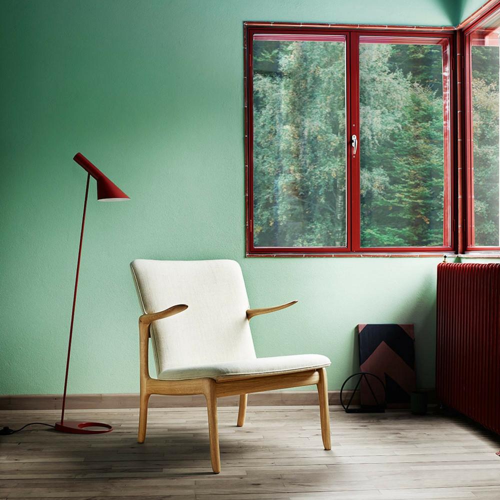 Carl Hansen and Son Ole Wanscher Beak chair in room with Arne Jacobsen Lamp