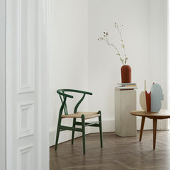 CH24 Wishbone Chair Soft Green with Sculpture in Copenhagen