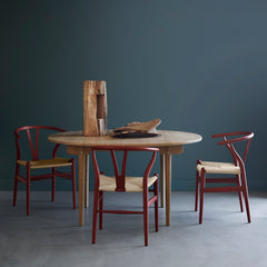 CH24 Wishbone Chairs Soft Red with CH337 Dining Table in moody grey room