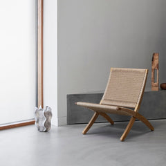 Carl Hansen Cuba Chair with Papercord styled in room with sculpture