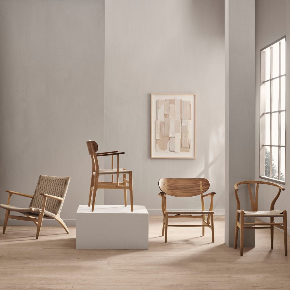 Carl Hansen Wegner CH26 Dining Chair on Pedestal in room with CH24, CH25, CH22 chairs