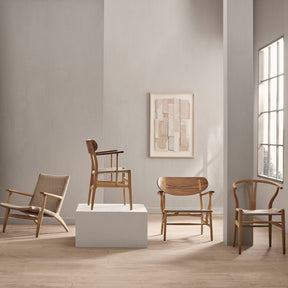 Carl Hansen Wegner CH26 Dining Chair on Pedestal in room with CH24, CH25, CH22 chairs