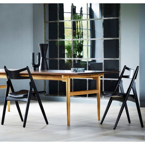 Hans Wegner CH29 Sawbuck Dining Chairs all Black in room with CH327 Table