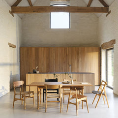 Carl Hansen Wegner CH327 Dining Table in Danish Summer House Kitchen with mixed Wegner Dining Chairs
