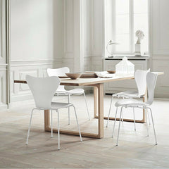 Cecilie Manz Essay Table in room with white Series 7 Chairs Arne Jacobsen Fritz Hansen