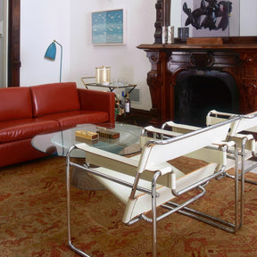 Red Leather Pfister Sofa in room with Ivory Leather Wassily Chairs Knoll