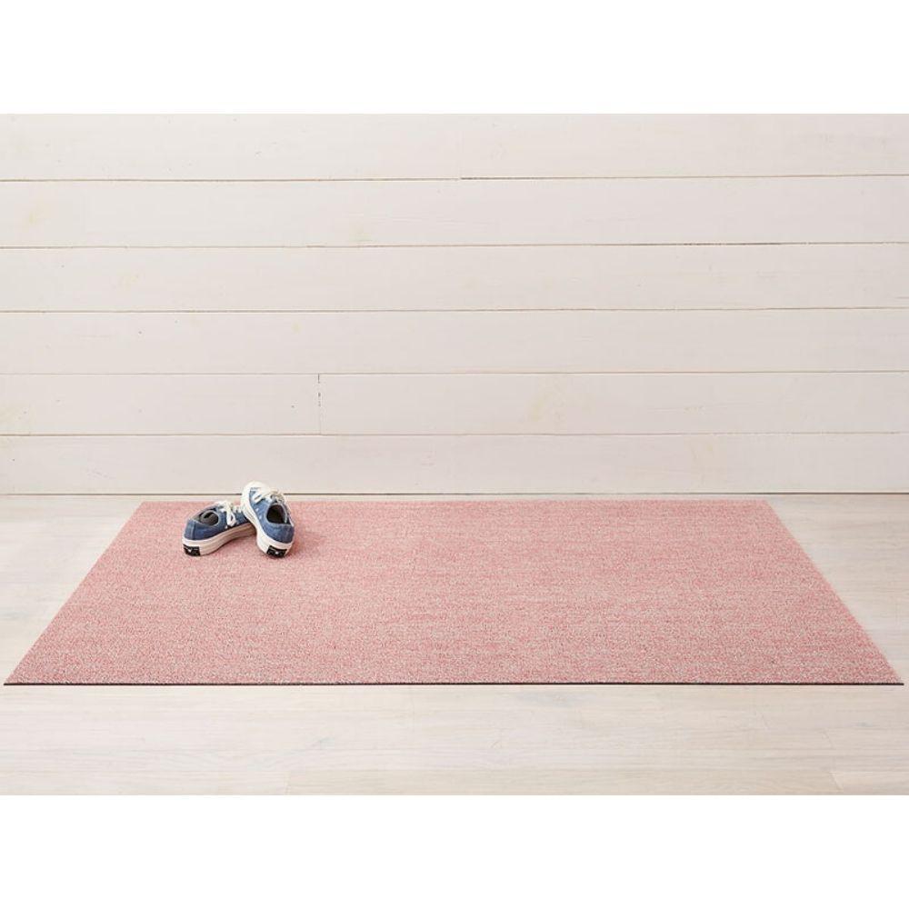 https://www.paletteandparlor.com/cdn/shop/products/chilewich-heathered-shag-floor-mat-blush-with-shoes_1000x.jpg?v=1632169383