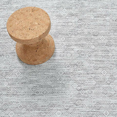 Chilewich Mosaic Floor Mat in White/Black with Vitra's Jasper Morrison Cork Stool
