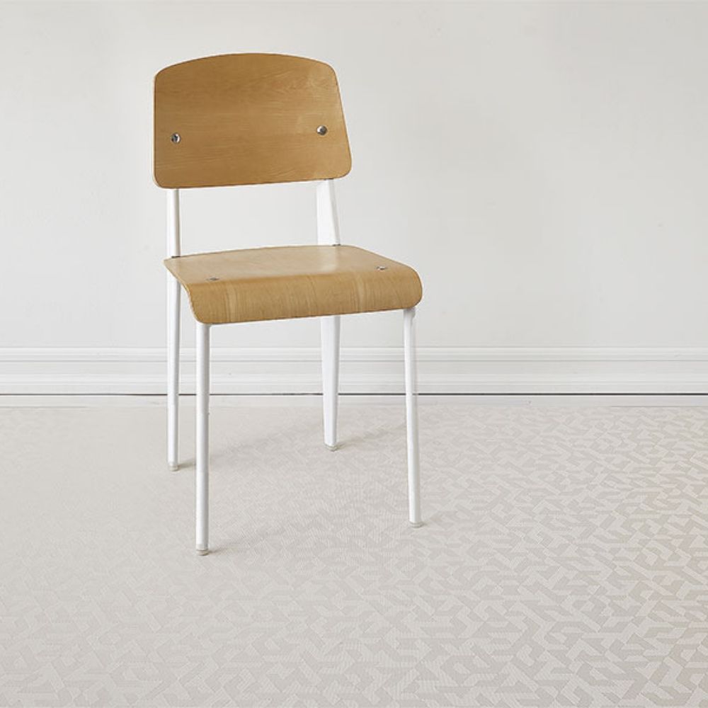 Chilewich Prism Floor Mat Natural in room with Prouvé Standard Chair