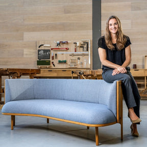 Rikke Frost in Carl Hansen & Søn's factory with the Sideways Sofa she designed