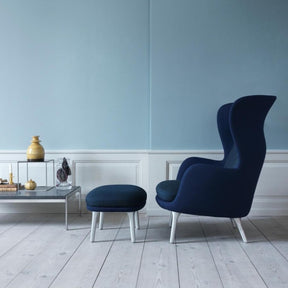 Dark Blue Ro Chair in Profile in Room with Poul Kjaerholm Coffee Table