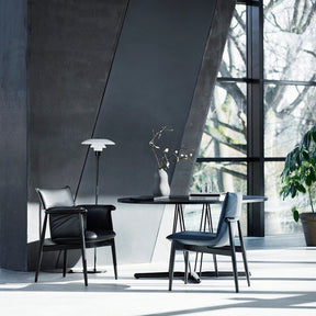 EOOS EO04 and EO05 Dining Chairs in Room with Black Embrace Dining Table