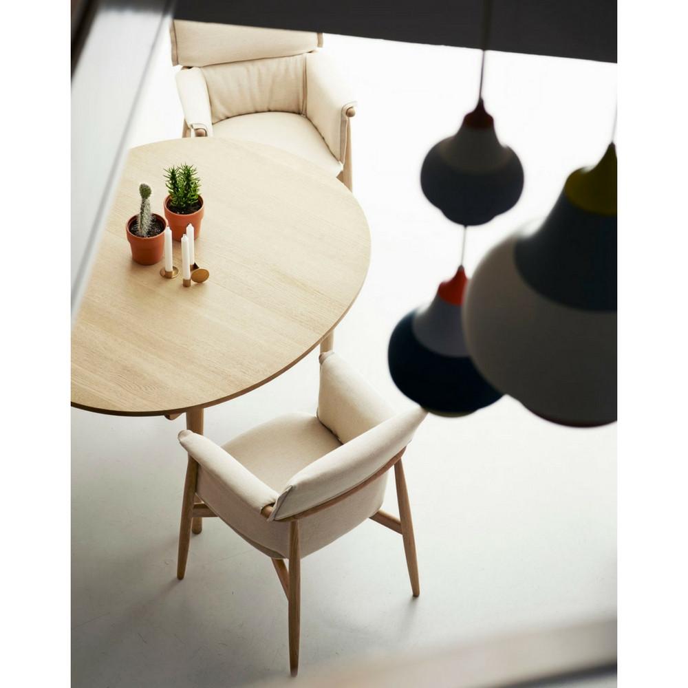 Eoos Embrace Dining Chairs by Carl Hansen and Son in room with Louis Poulsen Pendant Lights