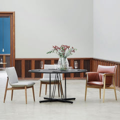 EOOS EO04 and EO05 Embrace Dining Chairs in room with Embrace dining table Carl Hansen and Son