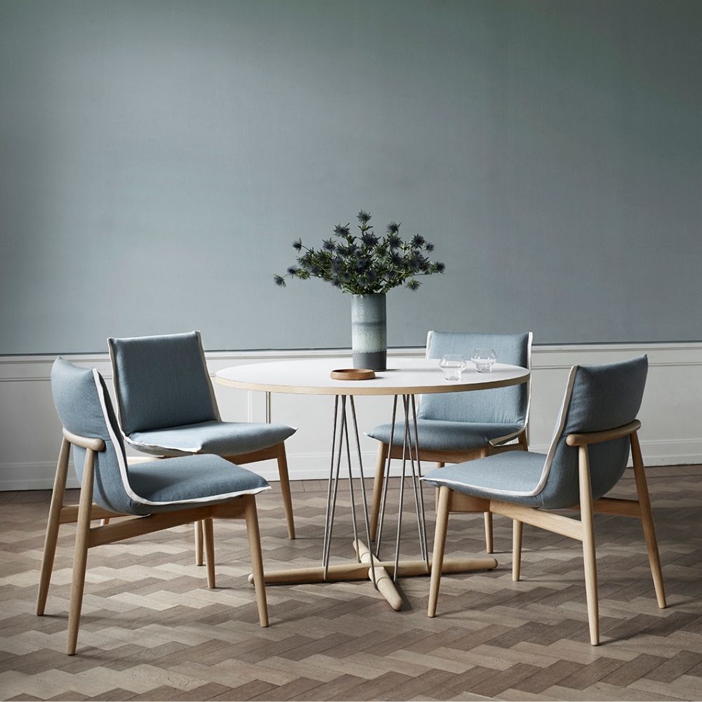 EOOS EO04 Embrace Dining Chairs in room with Embrace dining table and flowers Cal Hansen