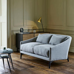 ercol Originals Nesting Tables in room with Rho Sofa by Matthew Hilton and Modulo Console