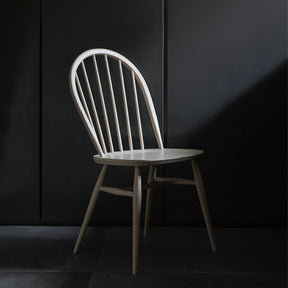 ercol Originals Windsor Chair 1877 in room with black walls