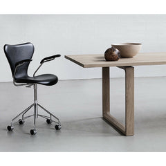 Essay Table in Room with Upholstered Series 7 Chair on Casters Fritz Hansen