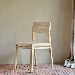 Ethnicraft Oak Ex 1 Chair 50657 in Room with Brick Floor