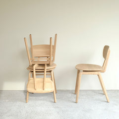 Ethnicraft Oak Pebble Dining Chairs Stacked