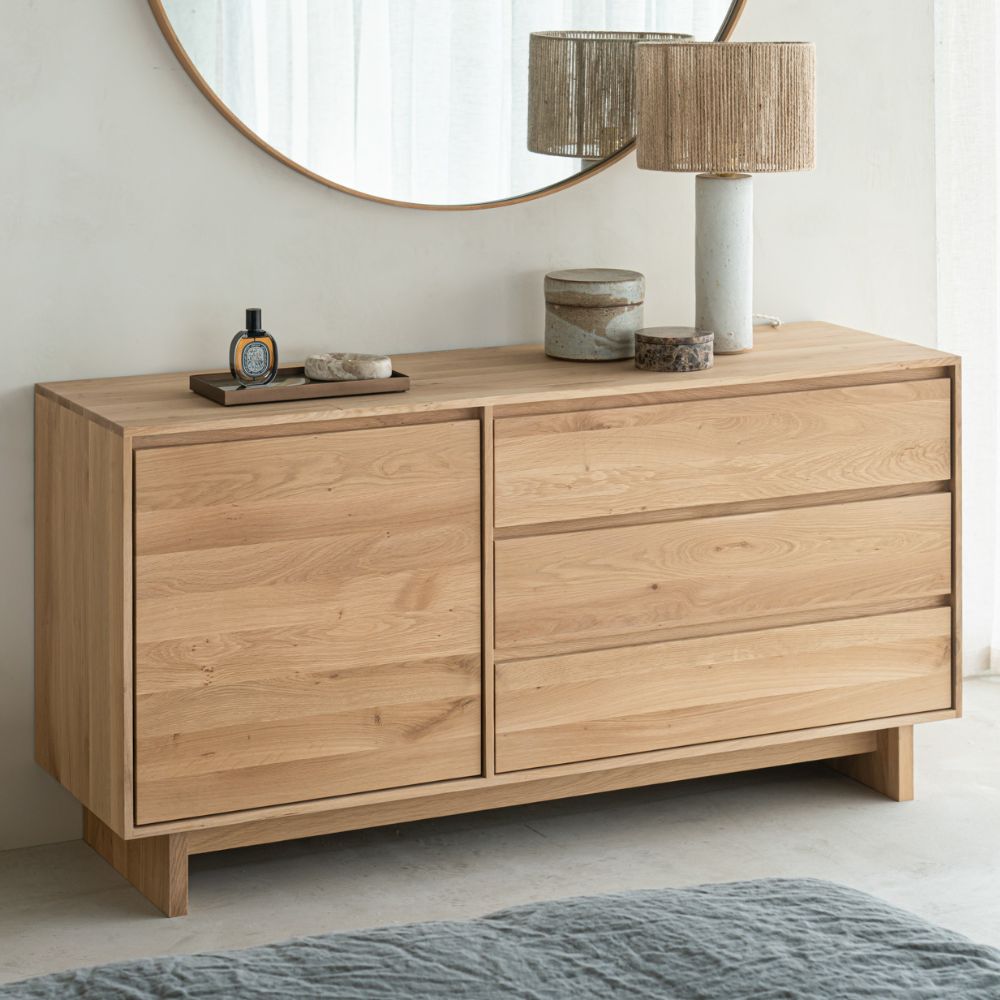 Ethnicraft Oak Wave Dresser in Bedroom with Mirror and Lamp
