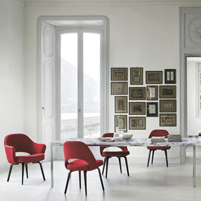 Florence Knoll Marble Dining Table in Room with Red Saarinen Executive Chairs