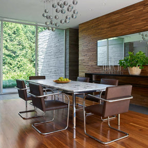 Florence Knoll Marble Dining Table in room with BRNO chairs by Mies van der Rohe