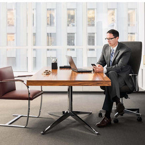 Florence Knoll Executive Desk Rosewood in Office with BRNO and Remix chairs