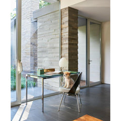 Florence Knoll Mini Desk with Glass Top in room with Saarinen Executive Armless Chair with Plastic Back