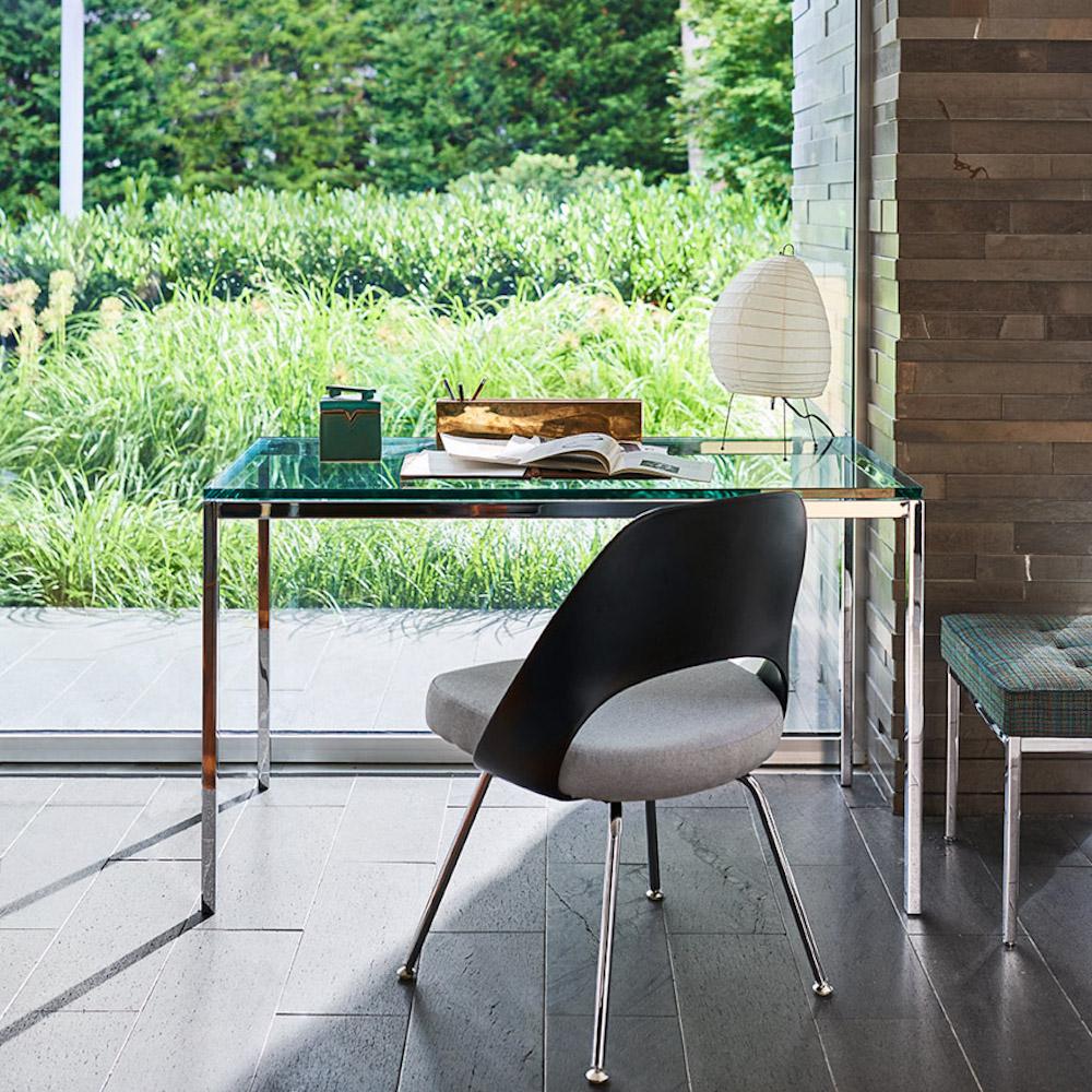 Florence Knoll Mini Desk in room with view of garden and Saarinen Executive Chair